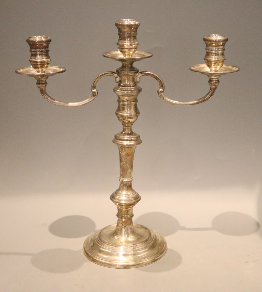 A modern silver two branch three light silver candelabrum, William Comyns & Sons Ltd, London, 1966/7, height 35cm, weighted.